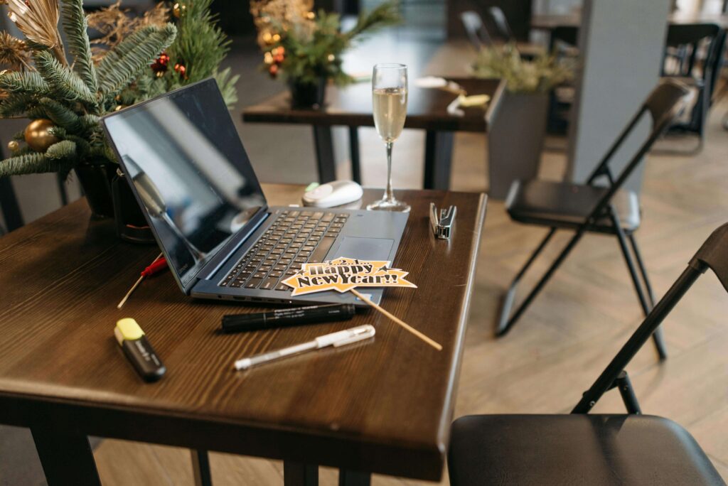 Christmas decorations on a desk with a laptop