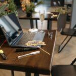 Christmas decorations on a desk with a laptop